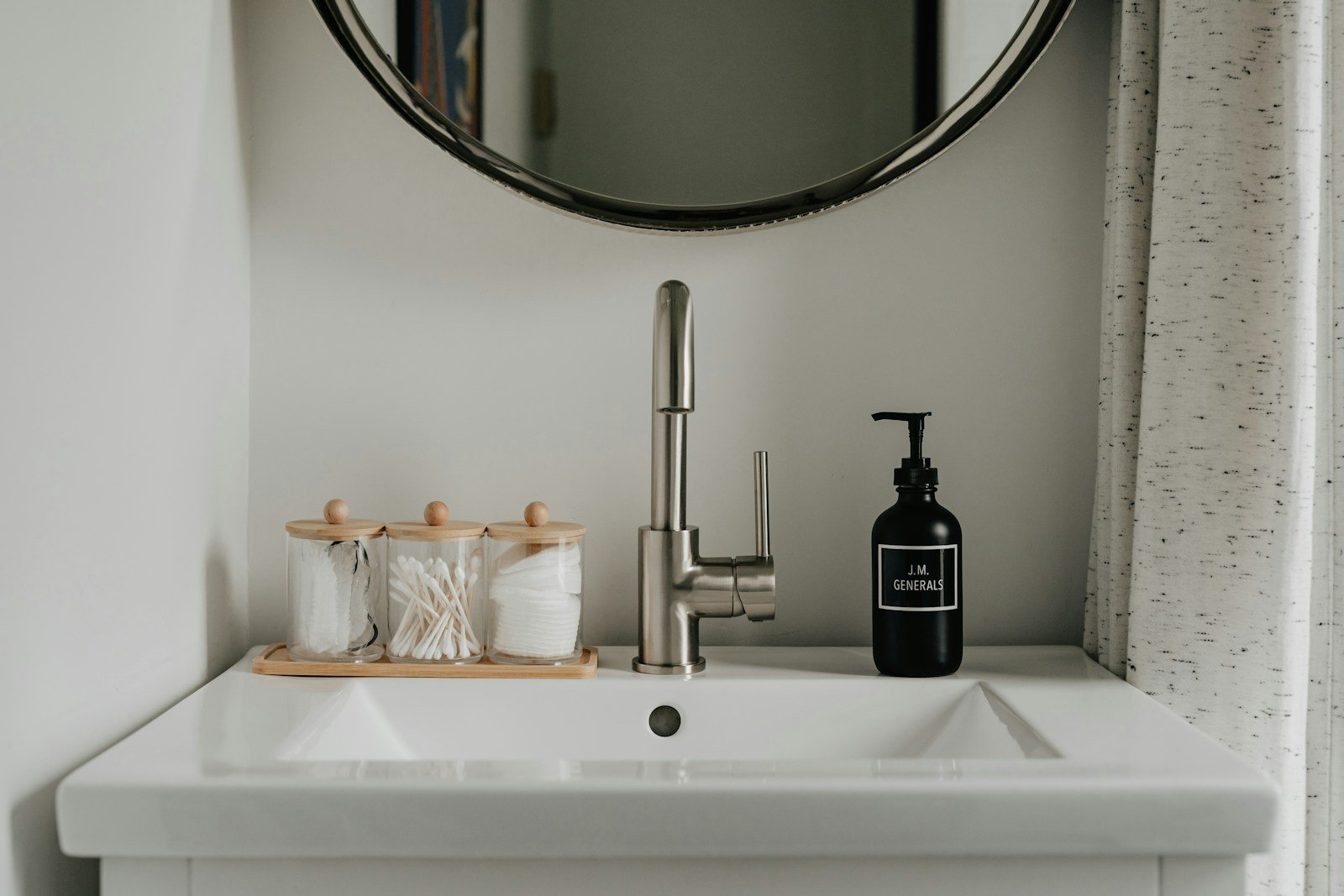 Bright, clean bathroom sink and mirror