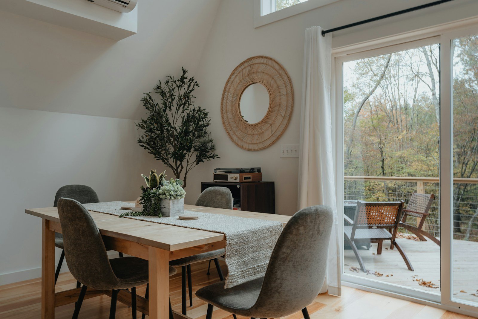 Bright guest-ready dining area with large windows